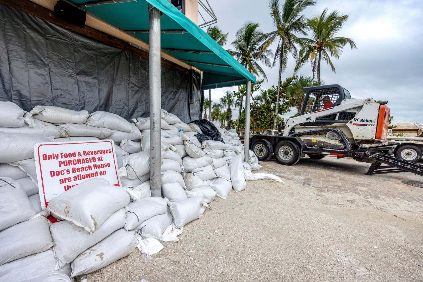 Mandatory Credit: Photo by CRISTOBAL HERRERA-ULASHKEVICH/EPA-EFE/Shutterstock (14768605x) A restaurant is surrounded by sand bags as the city prepares for Hurricane Milton in Bonita Beach, Florida, USA, 08 October 2024. According to the National Hurricane Center's Live Hurricane Tracker, Hurricane Milton is set to make landfall on the west coast of Florida on the evening of 09 October. After rapidly intensifying into a Category 5 storm on 07 October, Milton is expected to weaken as it reaches shore but will still bring significant weather impacts across the state. Florida prepares for landfall of Hurricane Milton, Fort Myers, USA - 08 Oct 2024